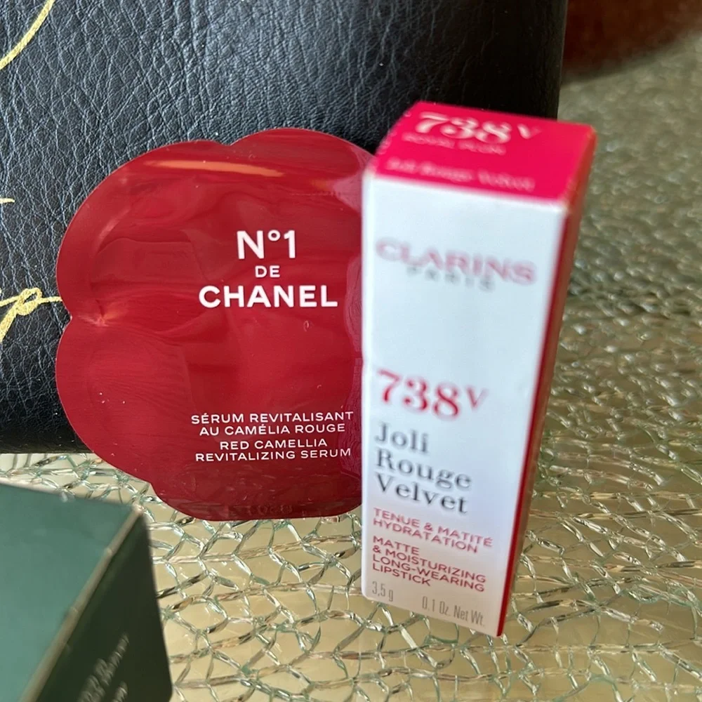 COSMETIC BAG WITH LOTS OF LITTLE ITEMS!  CLARINS LIPSTICK 738V IS FULL SIZE